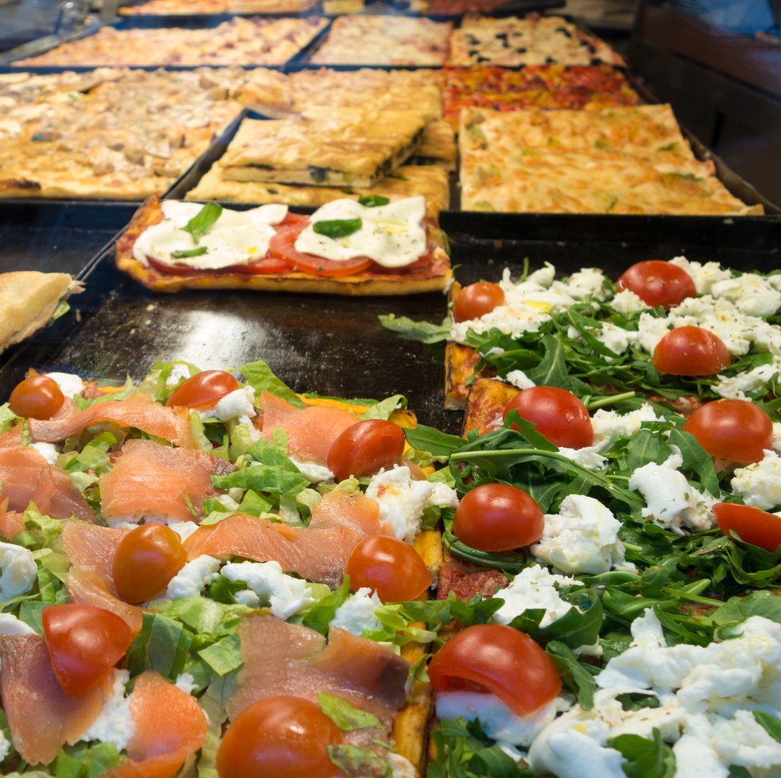 Pizza al taglio on display in Rome, Italy